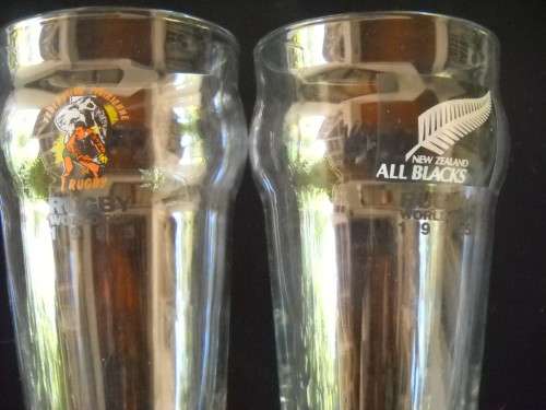 SET OF FOUR 1995 WORLD CUP GLASSES -ALL BLACKS, FRANCE, SCOTLAND & IVORY COAST