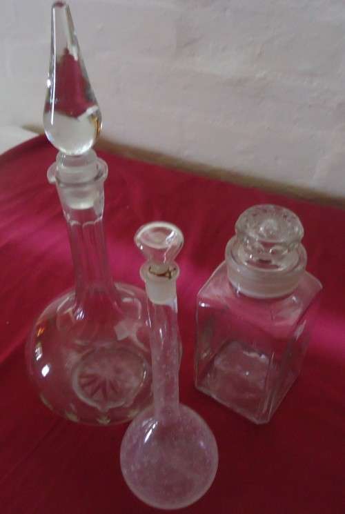 THREE UNIQUELY SHAPED  VINTAGE CLEAR GLASS CHEMIST-APOTHECARY BOTTLES WITH GLASS STOPPERS-SEE PHOTOS