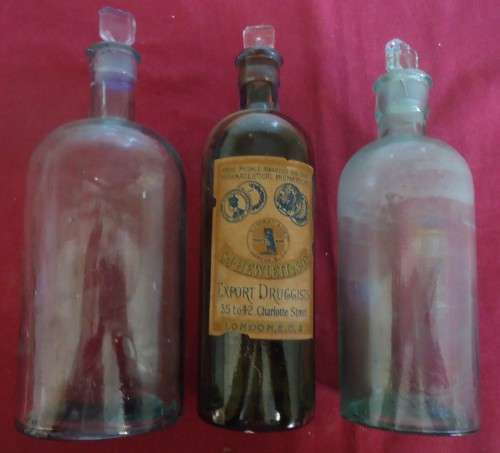 THREE DIFFERENT SIZE ROUND SHAPE CLEAR ICE BLUE GLASS VINTAGE CHEMIST / APOTHECARY BOTTLES W/ LABELS