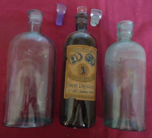 THREE DIFFERENT SIZE ROUND SHAPE CLEAR ICE BLUE GLASS VINTAGE CHEMIST / APOTHECARY BOTTLES W/ LABELS