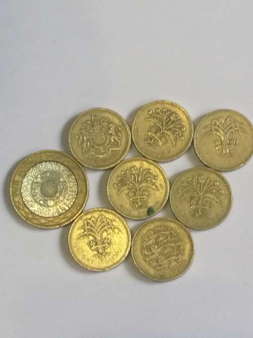 SELECTION OF BRITISH POUND COINS . SOME RARE .