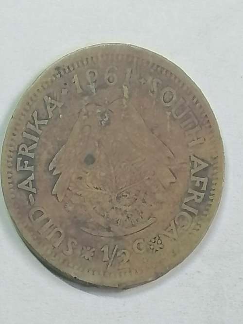 1961 HALF CENT UNION OF SOUTH AFRICA, COIN HAS ASTRANGE OVAL SHAPE,NOT SURE IF EEROR COIN.