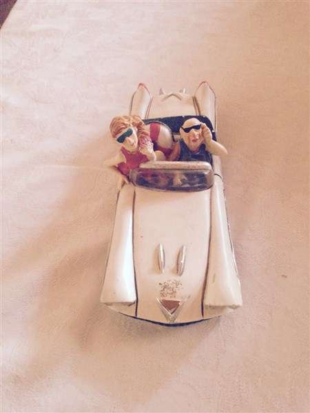 Interesting Car Figurine with Passengers for the Collector!