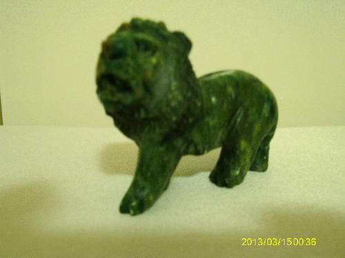 Miniature carved lion Verdite stone.
