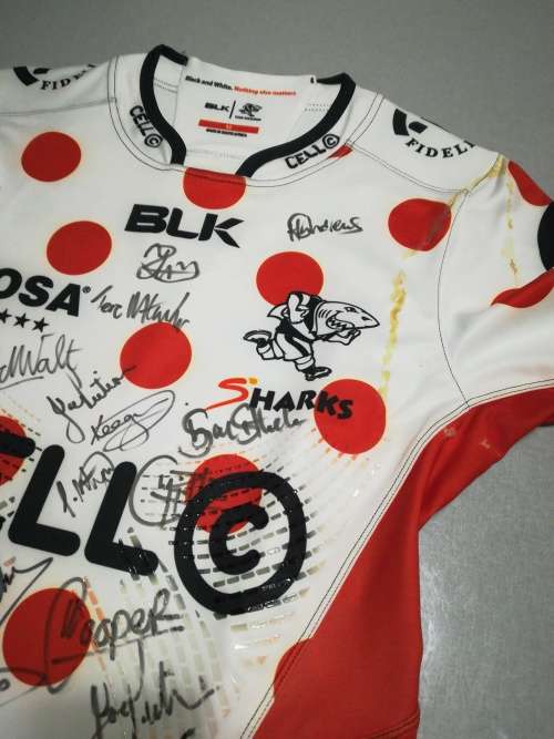 Sharks Training Jersey Signed, previously framed with some glue marks.