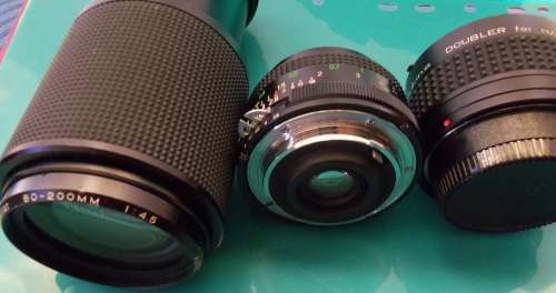 Nikon 1978 FE camera with 50 mm lens. Package-Vivitar 200 mm + 28 mm lenses and doubler in case.