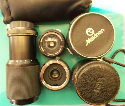 Nikon 1978 FE camera with 50 mm lens. Package-Vivitar 200 mm + 28 mm lenses and doubler in case.