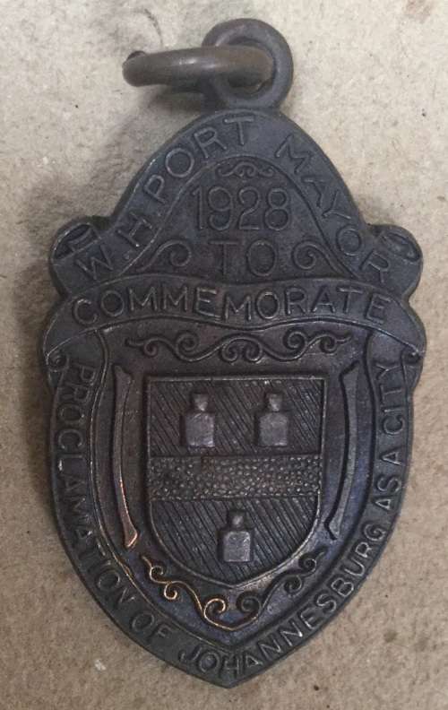 Three medallions issued by Johannesburg....one bid takes all