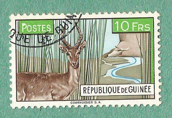 Guinea Stamp. Sold as is.