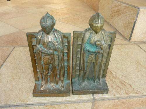 Four cast iron Knight door stoppers