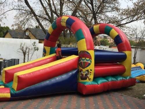 4m x 4m Rainbow Jumping Castle with 5m slide *Valued at R15,000*