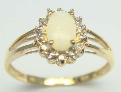 **R13 900.00** SOLID 10KT GOLD 0.32ct DIAMOND & NATURAL OPAL RING AAA GRADE!! DONT MISS!!