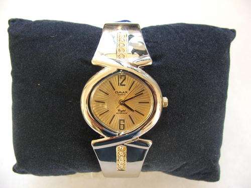 ***NEW!!!****DIVINE!!!***SWISS DESIGNED OMAX SILVER AND GOLD BANGLE WATCH WITH GENUINE CRYSTALS!!!