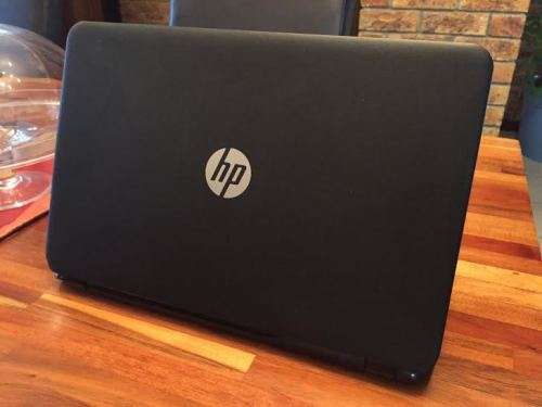 HP 15-r031si Notebook PC ( PLS see pics ) in excellent condition only 1 foot at bottom gone