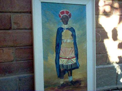 OIL ON BOARD OF AFRICAN WOMAN IN COLOURFUL COSTUME