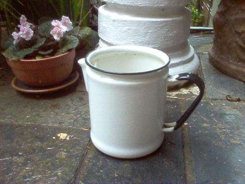 ENAMELWARE JUG IN BLACK AND WHITE.