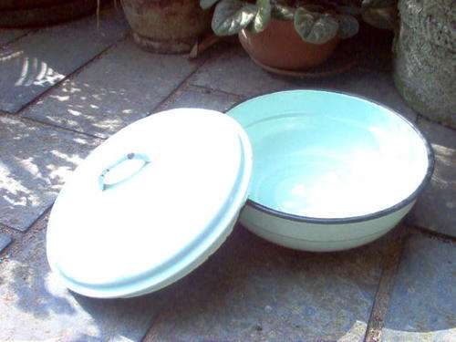 ENAMEL BOWL WITH LID IN GREEN ,TRIMMED IN BLACK.