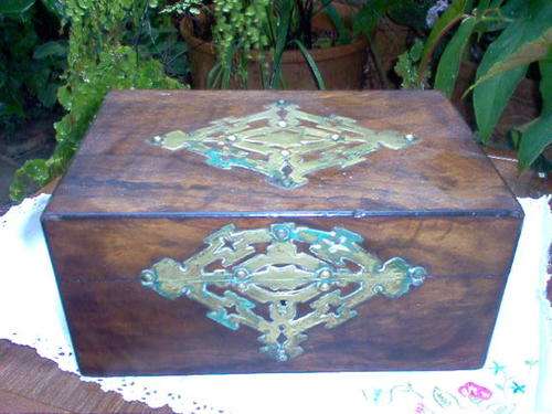 OLD WOODEN BOX WITH BRASS ORNAMENTATION.