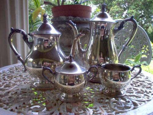 FOUR PIECE EM ESS SILVER PLATE TEA SET