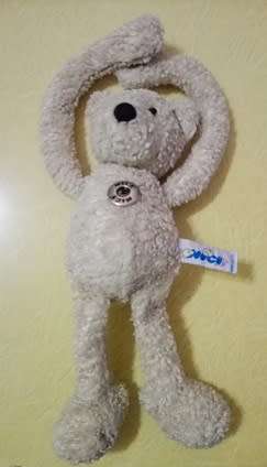 Curly Sue the Teddy Bear with Long Arms.  A Plush Nici Soft Toy with Tummy Button.