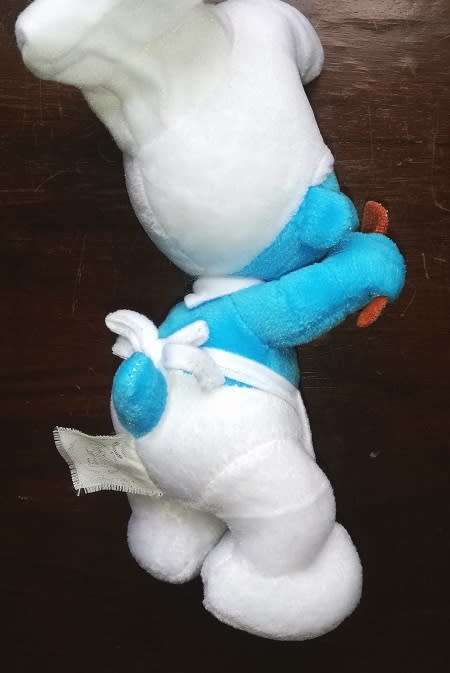 A delightful rare 'Cooking Smurf' plush toy.  24cm.