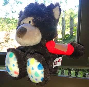 Cute little Nici Bear with red bandage on arm.  20cm.