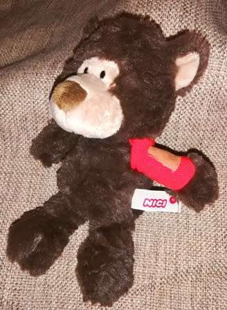 Cute little Nici Bear with red bandage on arm.  20cm.
