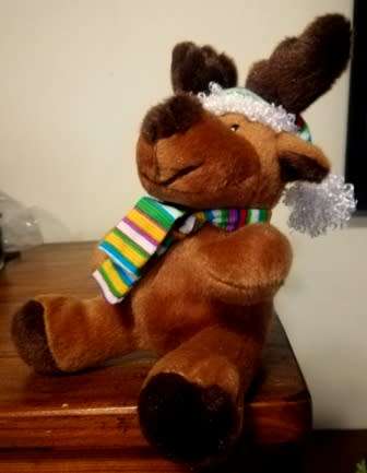 Pep the Moose with a stripey Christmas hat and scarf. 32cm.