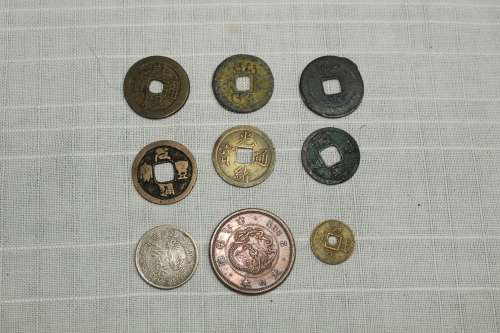 7 Chinese ancient coins plus one Japanese - all 1644 to 1911