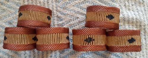 Elegant copper wire serviette rings, set of 6. As new.