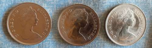FIVE commemorative coins:  Charles and Diana wedding x 2, Queen Mother`s 80th birthday x 3