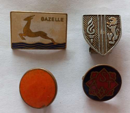Four vintage badges