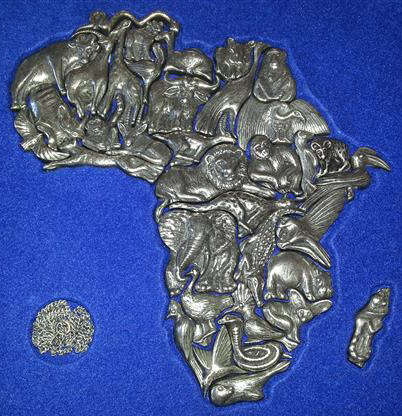 UNUSUAL CHRISTMAS GIFT, AFRICA  MAP PUZZLE, EACH  PIECE OF THE PUZZLE CONSISTS OF A PEWTER ANIMAL,