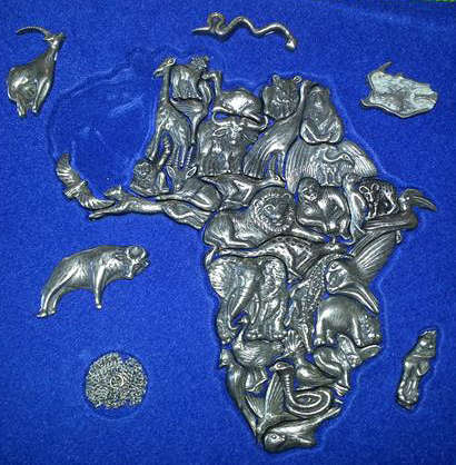 UNUSUAL CHRISTMAS GIFT, AFRICA  MAP PUZZLE, EACH  PIECE OF THE PUZZLE CONSISTS OF A PEWTER ANIMAL,