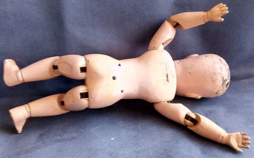 1913 H.E SCHOENHUT GERMAN, CARVED DOLL, SPRING LOADED JOINTS