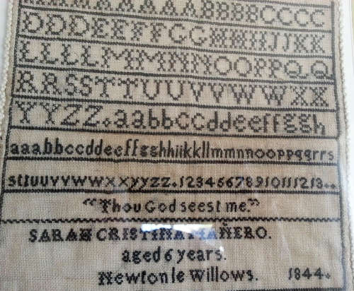 1844 SAMPLER SEWN BY 6 YEAR OLD SARAH CRISTINA MANERO,  BLACK ON WHITE COUNTED CROSS STITCH