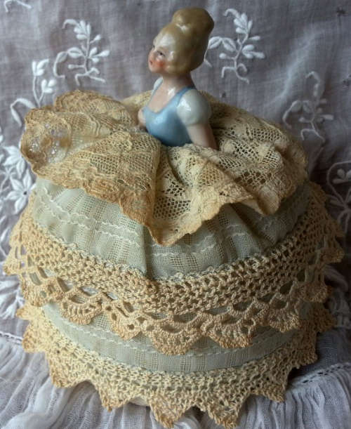 PRETTY AND DAINTY, ANTIQUE / VINTAGE PORCELAIN PIN CUSHION HALF DOLL DRESSED IN VINTAGE FABRIC