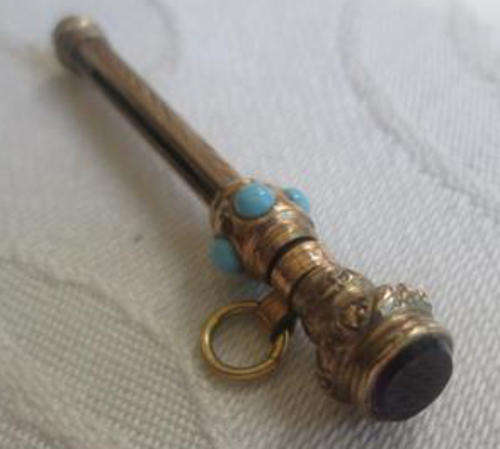 ANTIQUE ROLLED GOLD, NUT PICK WORN ON A FOB CHAIN OR CHATELAINE, SET WITH TURQUOISE AND AN AMETHYST