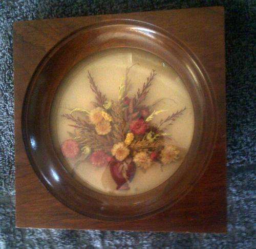 Glass and wood flower arrangement