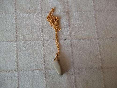 necklace, sand colour stone on gold chain