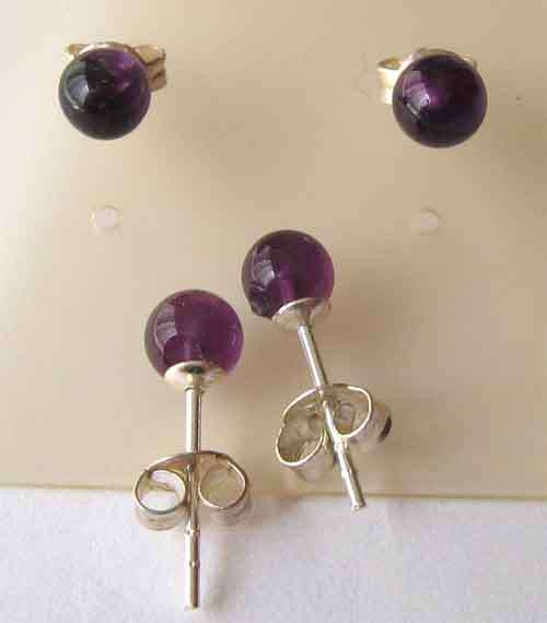A pair of Sterling Silver and  Genuine Amethysts Stud/   Earrings.