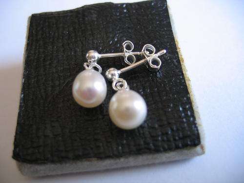 A pair of  Beautiful 925 Sterling Silver and Genuine Pearls Earrings.