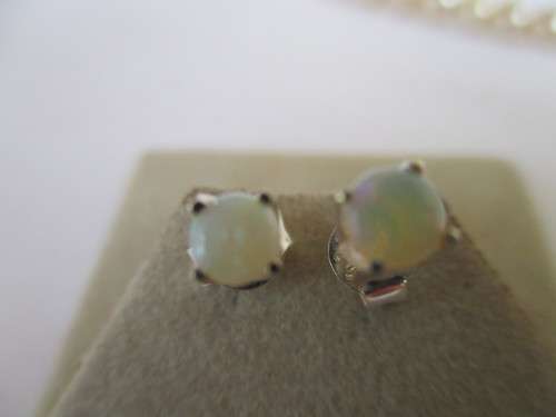 A Pair of Sterling Silver and Australian Opals Earrings