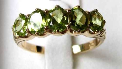 Stunning Peridots  and   9Ct. Yellow Gold Ring