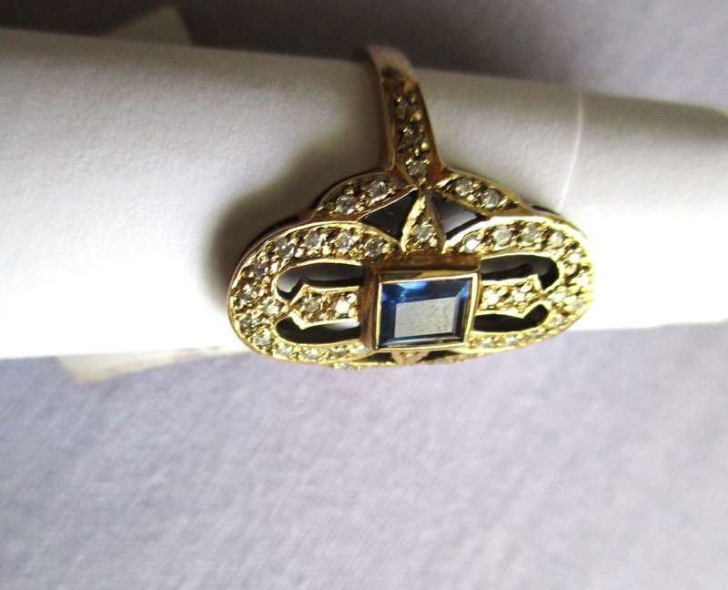 Splendid Diamonds and Blue sapphire in 9 Carat Yellow Gold Ring-