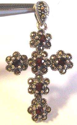 Pretty Garnet cross/ pendant in Silver.