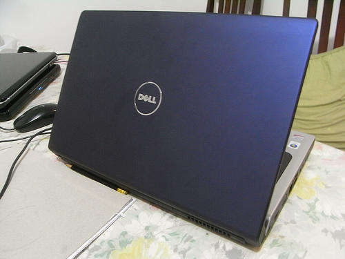 Good Condition Dell 1555 Laptop with bag and extra batterry worth R599 alone
