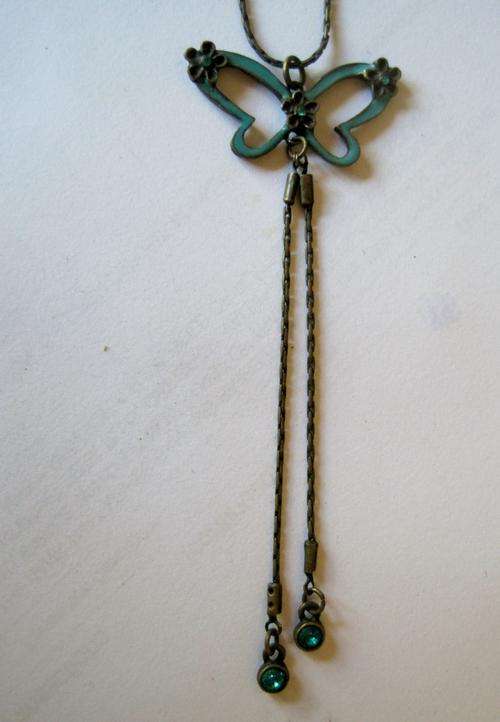 Dainty turquoise-coloured butterfly necklace, with crystals.