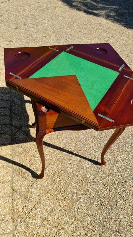 Mahogany card table on Queen Ann style legs.