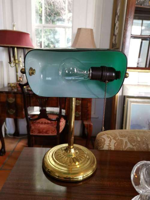 Brass and Emerald Green Glass Shade Bankers Desk Lamp with Chain Switch and Swivel Shade.
